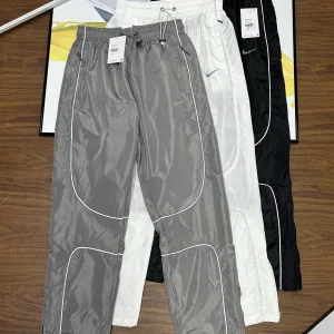 Designer Luxury Nike Casual Trousers Red Nylon Mesh Woven Fabric Unrestricted Movement Autumn Early Zippered Pocket